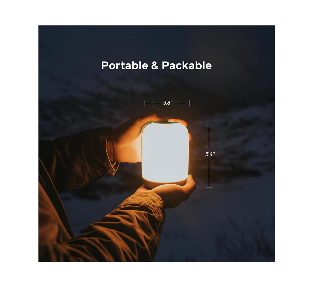 BioLite AlpenGlow 500 warm light mode illuminating campsite at night
