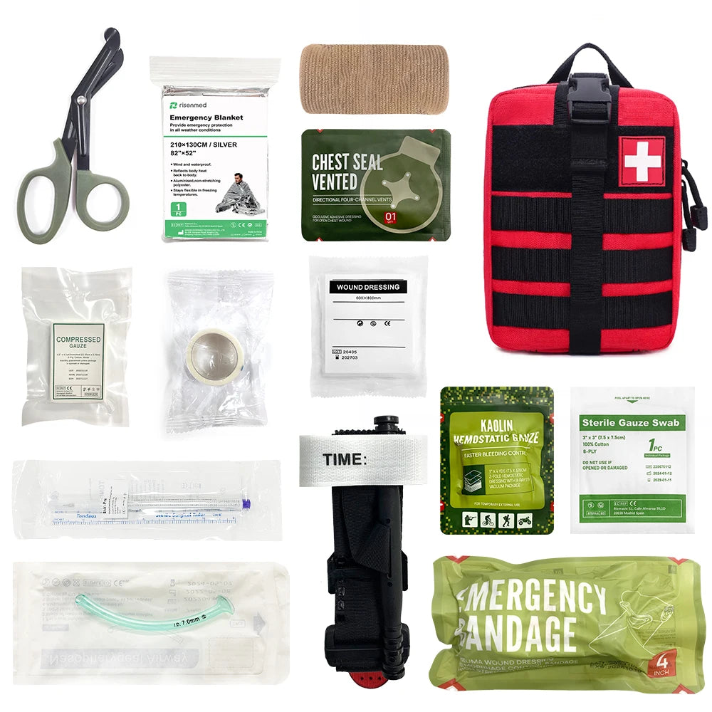 red first aid pouch with complete trauma kit contents laid out including bandages, tools and dressings

