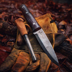 JEO-TEC No.18 fixed blade knife resting near campfire in outdoor setting
