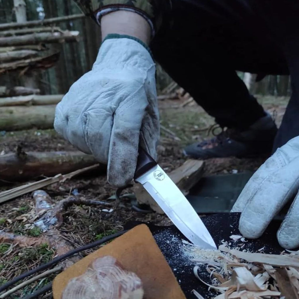 JEO-TEC No.18 bushcraft knife used alongside fire starter during camp fire lighting
