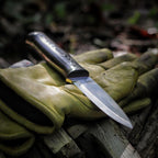 JEO-TEC No.18 fixed blade bushcraft knife used outdoors during camp tasks
