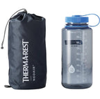 Packed Therm-a-Rest NeoAir XLite NXT sleeping pad with water bottle for size comparison
