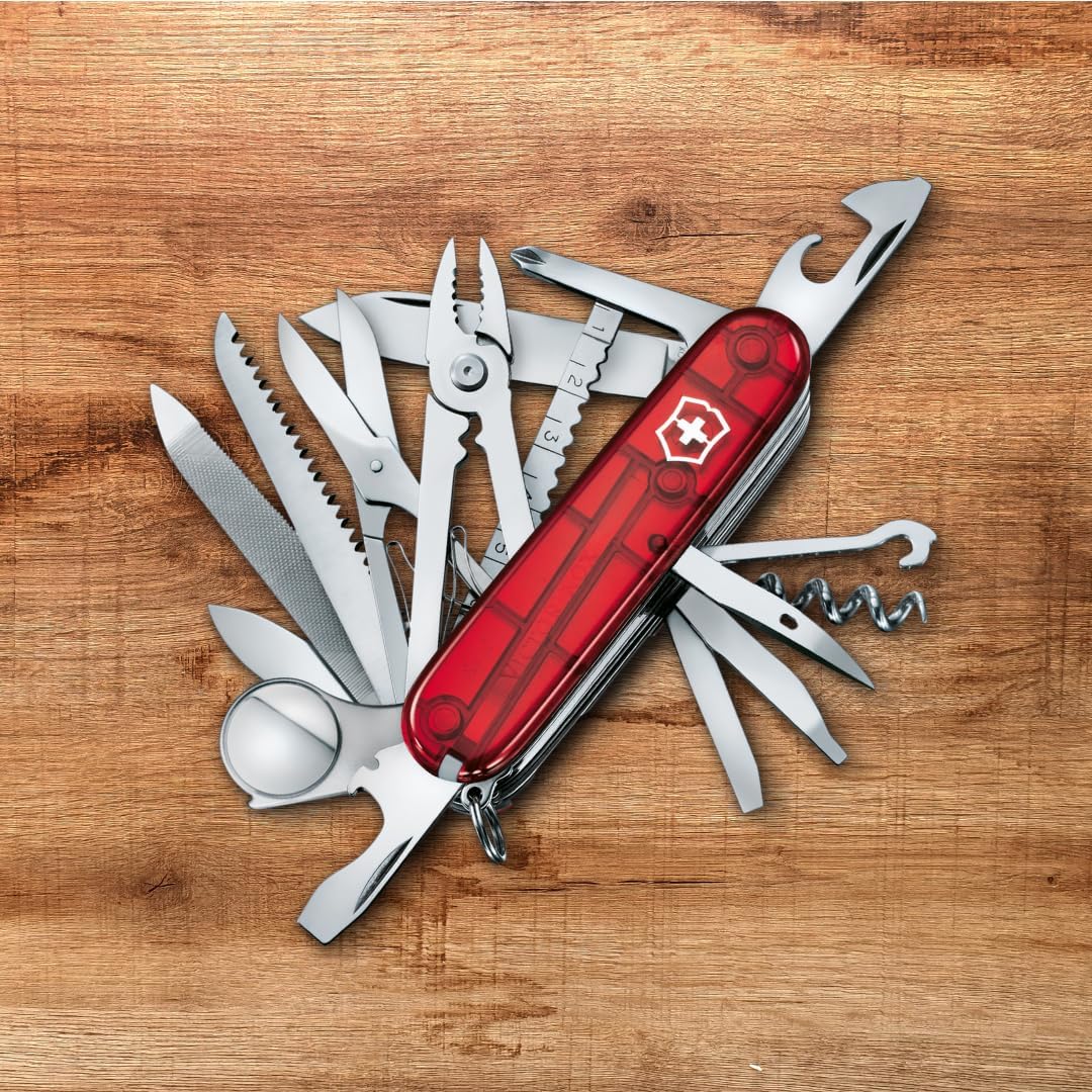 Victorinox Swiss Army knife tools laid out individually on wooden surface
